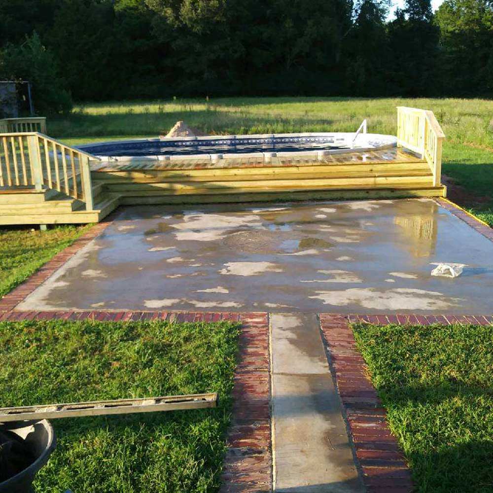 Customer photo: A beautiful and spacious deck built around a Matrix 15x26 oval pool!
