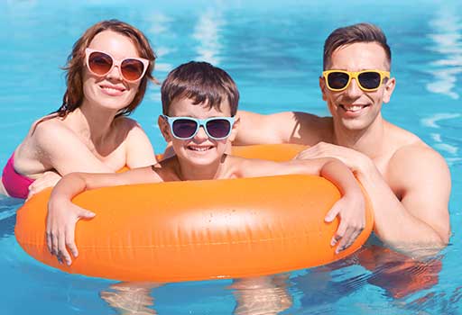 Family swimming in a pool